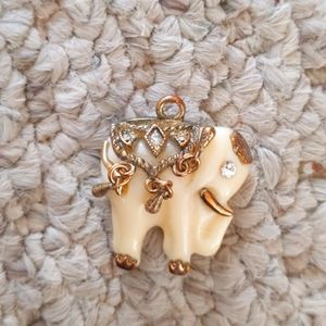 Ivory colored pendant elephant.